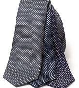 A classic silk tie, rendered in a subtle box pattern for dashing workday style.