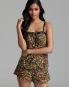 This sassy camisole short set features a printed silky chiffon floral camisole with contrasting trim.