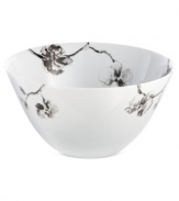 Compose a striking arrangement with the Black Orchid serving bowl by Michael Aram. Fine white Limoges porcelain flourishes under a dark watercolor motif inspired by foliage from around the world.