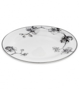 Compose a striking arrangement with the Black Orchid dinner plate by Michael Aram. Fine white Limoges porcelain flourishes under a dark watercolor motif inspired by foliage from around the world.