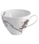 Compose a striking arrangement with the Black Orchid breakfast cup by Michael Aram. Fine white Limoges porcelain flourishes under a dark watercolor motif inspired by foliage from around the world.