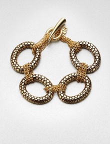 Large textured links accented with smaller wrapped link chains create an unique piece you'll wear again and again. Antique-finished goldtoneLength, about 7.75Toggle closureImported 