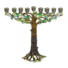 A creatively luxe essential for celebrating the holidays, this tree-inspired menorah glitters with dozens of hand-set Swarovski® crystals and glass gems set in hand-enameled cast pewter with an antique brash finish.