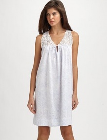 A back pleat and lace yoke embellishment add definition to a classic chemise.