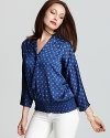 A timeless medallion print sets the scene on a wear-everywhere tie neck blouse from MICHAEL Michael Kors.