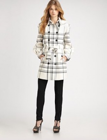 Classic trench styling, in an iconic check patterned wool blend.Foldover collarEpaulettesDouble breasted button frontSelf beltAsymmetrical sleevesBelted cuffsFully linedAbout 31 from shoulder to hem52% polyester/43% wool/5% lyocellDry cleanMade in Italy of imported fabricModel shown is 5'9½ (176cm) wearing US size 4. Additional Information Women's Premier Designer & Contemporary Size Guide 