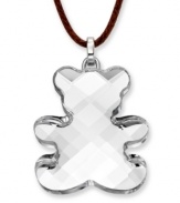 Cute and charming. Show off your playful side with Swarovski's Teddy Mini Pendant. Featuring a clear crystal silhouette, it includes a brown cotton cord as well as a secure lobster clasp and extender chain set in silver tone mixed metal. Approximate length: 15 inches + 2-inch extender. Approximate drop: 1-1/4 inches.