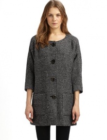 A simple collarless shape in a luxurious wool blend, with dolman sleeves and rustic wooden buttons.Round neckline Seamed yoke, front and back ¾ kimono sleeves Button front Dual patch pockets at front Fully lined About 33 from shoulder to hem 78% wool/18% polyester/4% other fibers Dry clean Made in USA