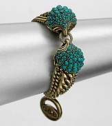 A Hellenic-inspired design that features a turquoise cabochon encrusted station and antique-finished brass link chains. TurquoiseAntique-finished brassLength, about 7.5Spring ring closureImported 