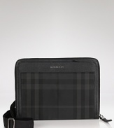 A dark smoky check pattern makes a sleek statement on this iconic crossbody messenger from Burberry.