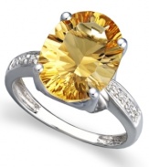 A bold burst of sunshine. Brighten any day when you don the warm tones of this oval-cut citrine ring (5-1/6 ct. t.w.). Round-cut diamond accents and a 14k white gold band add to the elegance.