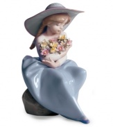 This little girl has her hands full. Admiring a cluster of beautifully colored blooms, the Fragrant Bouquet figurine is the essence of spring in glazed Lladro porcelain.