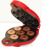 This do-it-all donut maker from Bella Cucina lets you serve up homemade mini doughnuts in no time flat (or round)! Baked instead of deep fried, these delicious treats are a healthier choice whenever you crave something sweet. One-year limited warranty. Model 13466.