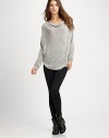 Slouchy, textured-knit cowlneck with long dolman sleeves and a curved hi-low hem. CowlneckDropped shouldersLong dolman sleevesCurved hi-low hemLonger length hits below the hips71% viscose/24% polyester/5% spandexDry cleanMade in USAModel shown is 5'11 (180cm) wearing US size 4.