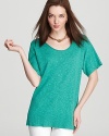 Linen and cotton team up to deliver an oh-so soft Eileen Fisher tunic. The slouchy silhouette sports a vibrant turquoise hue to make this basic anything but...basic.