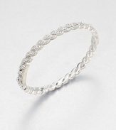 Graceful crystal-set feather shapes come together to form an elegant hinged bangle with shimmer that goes on and on.CrystalRhodium platingDiameter, about 2½Width, about ¼Box-and-tongue claspImported