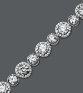 Enlighten your look with a little Arabella. This glamorous tennis bracelet features a unique circular design that highlights dozens of round-cut Swarovski zirconias (22-9/10 ct. t.w.). Crafted in sterling silver. Approximate length: 7 inches.