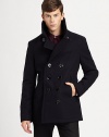 A classic double-breasted peacoat with modern shaping has an urban edge, in a rich wool blend.Oversized collarExtended lapelsDouble-breasted button closeVertical front welt pocketsBack half beltBack seamed detailingCenter back ventAbout 29 from shoulder to hemWool/nylonDry cleanImported