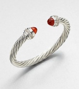 From the Cable Classics Collection. Dazzling diamonds accent this signature sterling silver cable design with carnelian end caps. CarnelianDiamonds, .48 tcwSterling silverDiameter, about 2Slip-on styleImported 