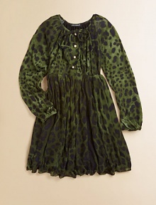 Long-sleeved, knit frock adorned with a bold leopard print and finished with pearl-like buttons and a full skirt.Round neckline with tieLong sleevesFront buttonsElastic waistbandFull skirtModalMachine washImported Please note: Number of buttons may vary depending on size ordered. 