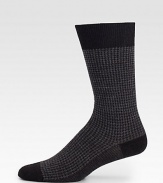 A stylish combination of jacquard and houndstooth adds charming appeal to these wool socks with a touch of stretch.Mid-calf height80% virgin wool/20% polyamideMachine washMade in Italy