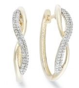 Up your glam factor. Yell'Ora's chic spiraling hoop earrings showcase round-cut diamonds front and center (1/3 ct. t.w.). Base metal made from a combination of pure gold, sterling silver and palladium. Approximate diameter: 3/4 inch.