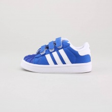 The adidas Superstar is one of our most beloved classics and available in a size for the next generation of superstars. With three velcro straps, this canvas toddlers shoe assures stability and style equally. Imported.