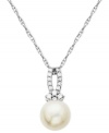 Stunning and sophisticated. This pendant features a cultured freshwater pearl and diamond accents for a stunning effect. Crafted from 10k white gold. Approximate length: 18 inches. Approximate drop length: 5/8 inch. Approximate drop width: 1/4 inch.