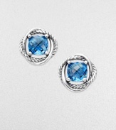 From the Infinity Collection. A richly colored, faceted blue topaz framed in intertwining bands of polished sterling silver, one smooth, one a signature cable.Blue topazSterling silverDiameter, about ¼Post backImported