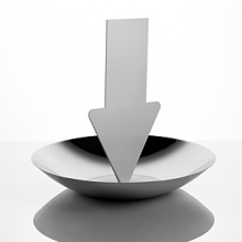 Fruit holder in 18/10 stainless steel mirror polished with message arrow board. Designed by Marti Guixe.