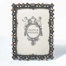 Rich frame with artisan touches. Dozens of hand-set agates and intricate filigree work.