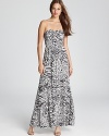 Tap into your wild side with this animal-print GUESS strapless dress, cut in a flowing maxi silhouette.