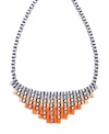 Infuse your look with a citrus-colored statement maker. Bar III's stunning necklace features a pyramid-shaped necklace decorated with ribbons in neon orange, pastel orange, and light grey hues. Set in silver tone mixed metal. Approximate length: 24 inches. Approximate drop length: 2 inches. Approximate drop width: 6-1/2 inches.