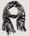 Bundle up in Burberry's soft cashmere scarf with signature giant check print.