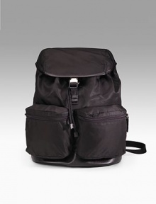 Nylon backpack with outside double pockets and clip closure. Leather trim Jacquard lining 13¾H X 11½L X 6½W Made in Italy 