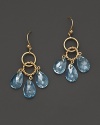 Faceted pear cut blue topaz adds rich sparkle to links of 14K yellow gold. By Nancy B.