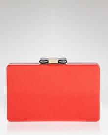 Perfect the hand-off with this clutch from kate spade new york. Boxy and bold, it has just the right amount of ladylike glamor, thanks to it's glossy hue and bow detailing.