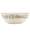 Perfect for entertaining, this large bowl is trimmed with gold and a holly motif to match the beloved Lenox Holiday dinnerware collection.