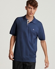 The brand's signature check makes a subtle appearance on this classic Burberry pique polo.