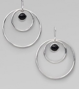 From the Scultura Collection. Double circles of polished sterling silver surround a center drop of smooth black onyx.Black onyx Sterling silver Diameter, about 2¼ Ear wire Imported