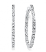 Reflect the light from every angle. These sparkling hoop earrings feature an in and out design decorated with round-cut diamonds (1/2 ct. t.w.). Set in 14k white gold. Approximate inch. 1 inch.