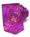 A detailed butterfly and floral print in vibrant colors adorns this silk tie from DUCHAMP.