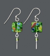 Get glam with bright green glass. What better way to spice up your ensemble than to add bold color. These Jody Coyote earrings feature assorted green glass square drops, stick drop charms, and green glass and silver accent beads. Set in sterling silver. Approximate drop: 1-1/2 inches.