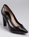 Sophisticated and sleek with forward details, these CoSTUME NATIONAL pumps feature a sharp heel and a v-shaped cutout.