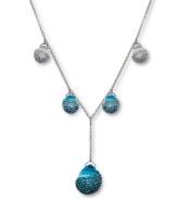 Dazzling and dramatic. Aquarmarine-hued crystals combine with clear crystal Pointiage® accents to enhance the beauty of Swarovski's Play Indicolite Y pendant necklace. Set in silver tone mixed metal. Approximate length: 15-7/10 inches. Approximate drop: 1-1/2 inches.