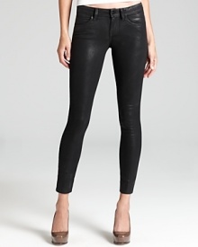 Rock it out in these skinny jeans by GUESS for the look of leather and the comfort of well-worn denim this season.