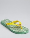 Tory Burch does flip flops, reinvented with a vibrant patterned footbed and summery appeal.