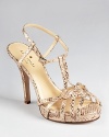 Strappy, snakeskin embossed leather makes a sassy statement on kate spade new york's Renee sandals.