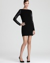 Luxe leather details lend an edgy look to a cozy knit sweater dress from Nicole Miller.