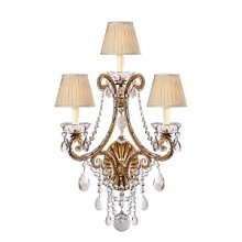 The curved arms, cascading crystals and candle flame-shaped bulbs on this Ralph Lauren sconce will illuminate your decor with unparalleled glamour.